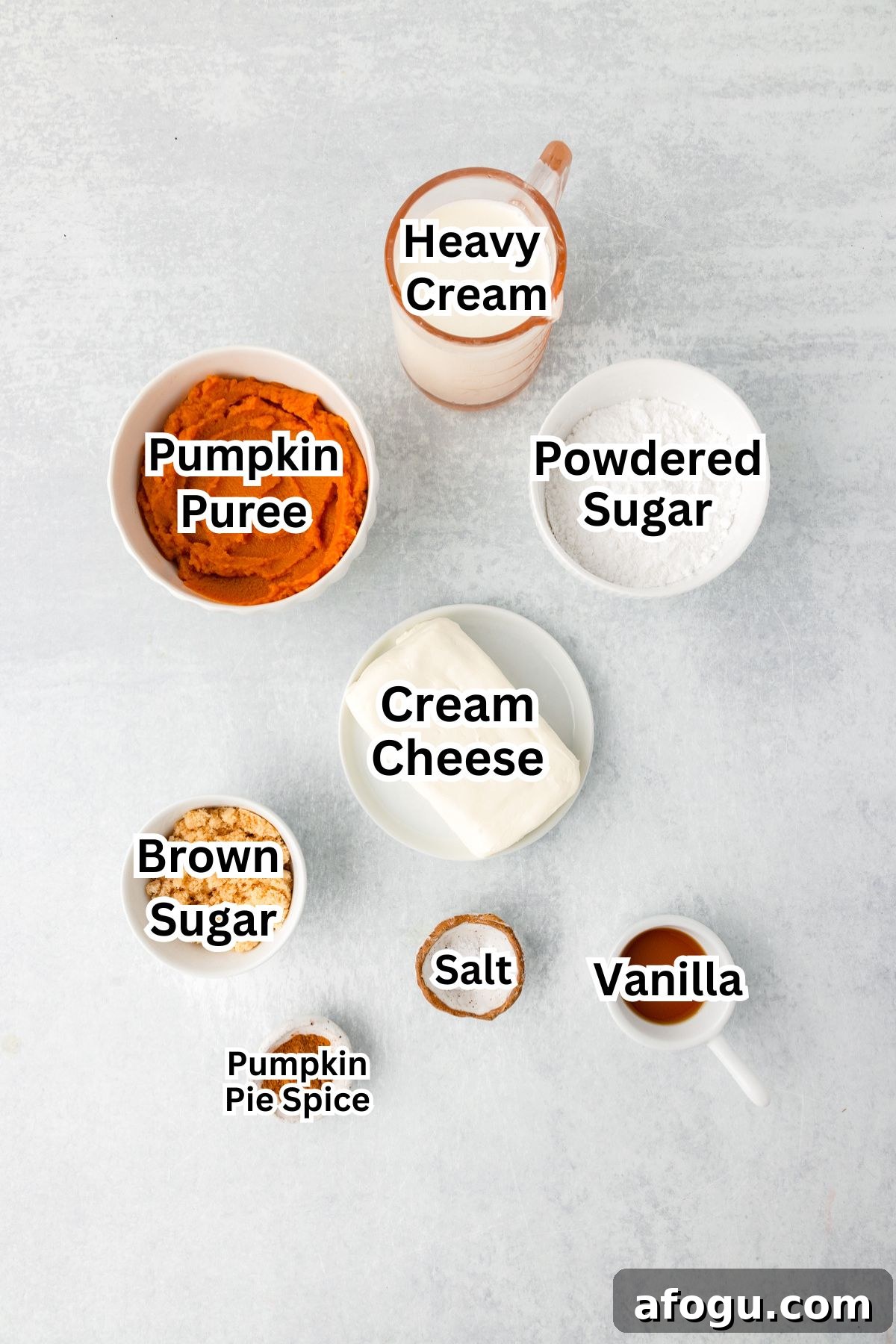 A flat lay of ingredients in bowls labeled to make pumpkin dip.