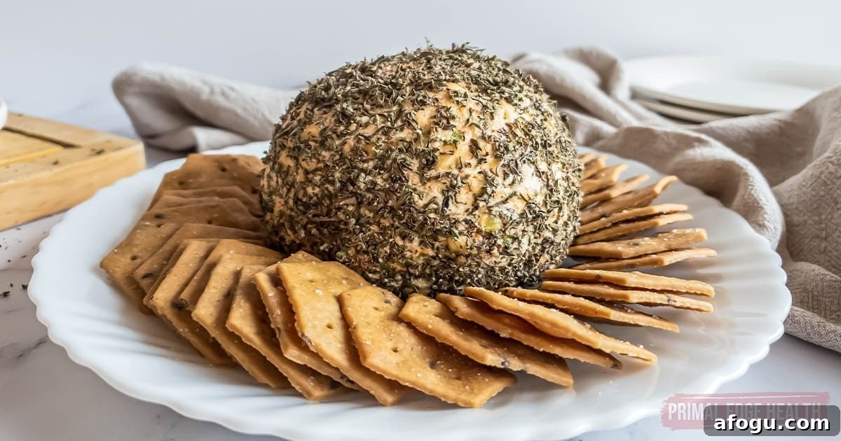 Nut-free cheese ball and crackers on a plate.