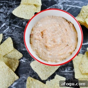 cream cheese and salsa dip with chips.