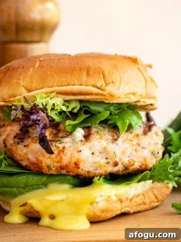 Grilled chicken burger on a bun with garlic aioli.
