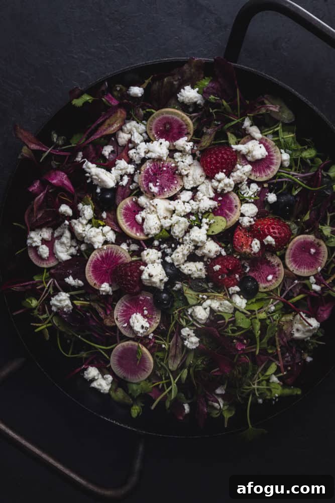 Summer Salad Recipe That Keeps Giving All Season Long 9 a summer green salad with berries, radishes, and cheese, overhead shot.