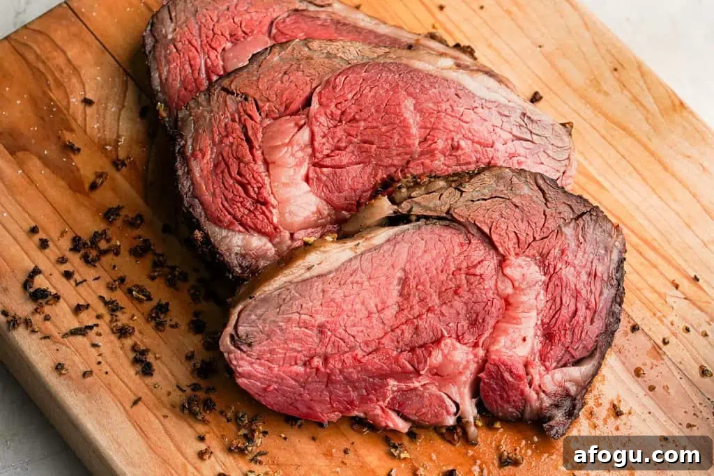 small sliced prime rib roast on a cutting board
