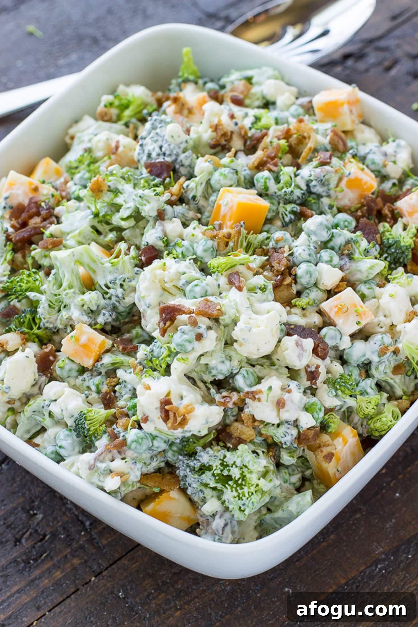 Broccoli salad assembled and in a serving bowl.