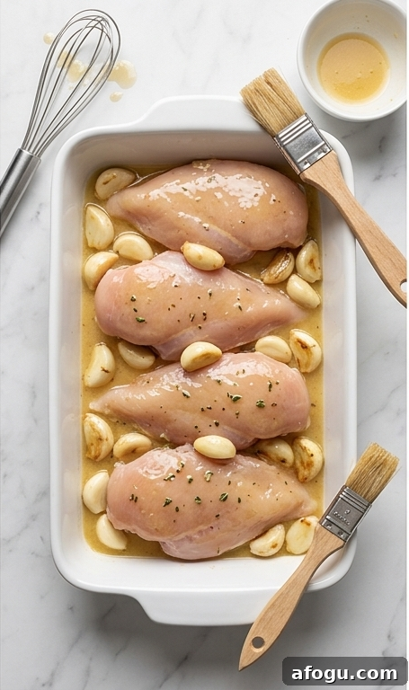 Chicken and garlic in baking dish