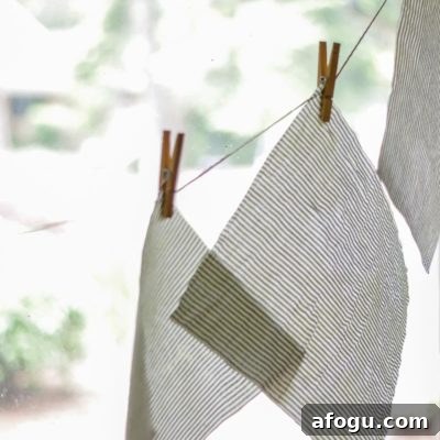 DIY Beeswax Food Wraps: Step-by-Step Guide for Reusable Wraps 8 beeswax fabric hanging on twine with clothes hanger