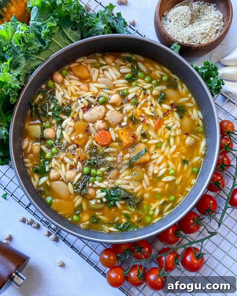 overhead shot looking into a big bowl of hearty beans and kale soup