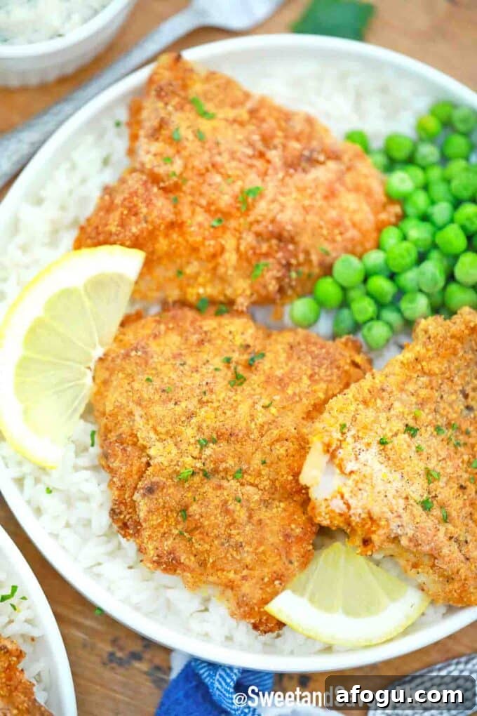 Air fried fish fillets served with rice and green peas.