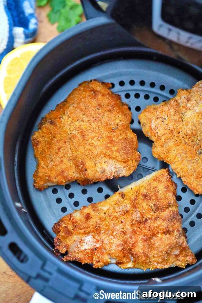 Cooked air fryer crispy fish fillets.
