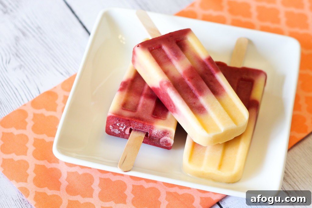 Dairy Free Peach Berry Yogurt Popsicles. Creamy, fruity and so refreshing!