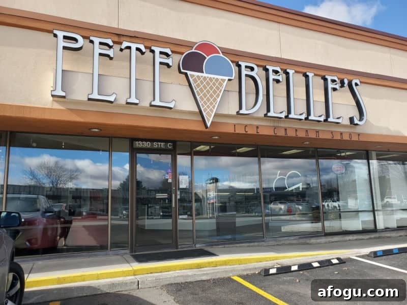 Pete Belle's sign with an ice cream cone over the front entrance to a candy store