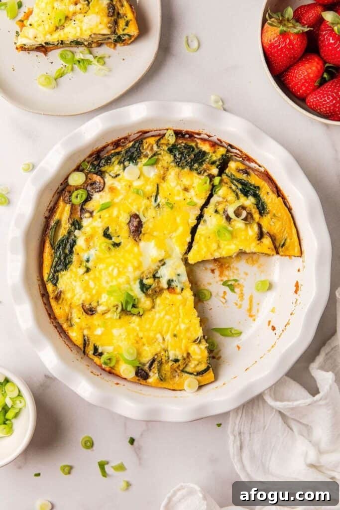 gluten free feta quiche with mushrooms, zucchini, onions, and spinach