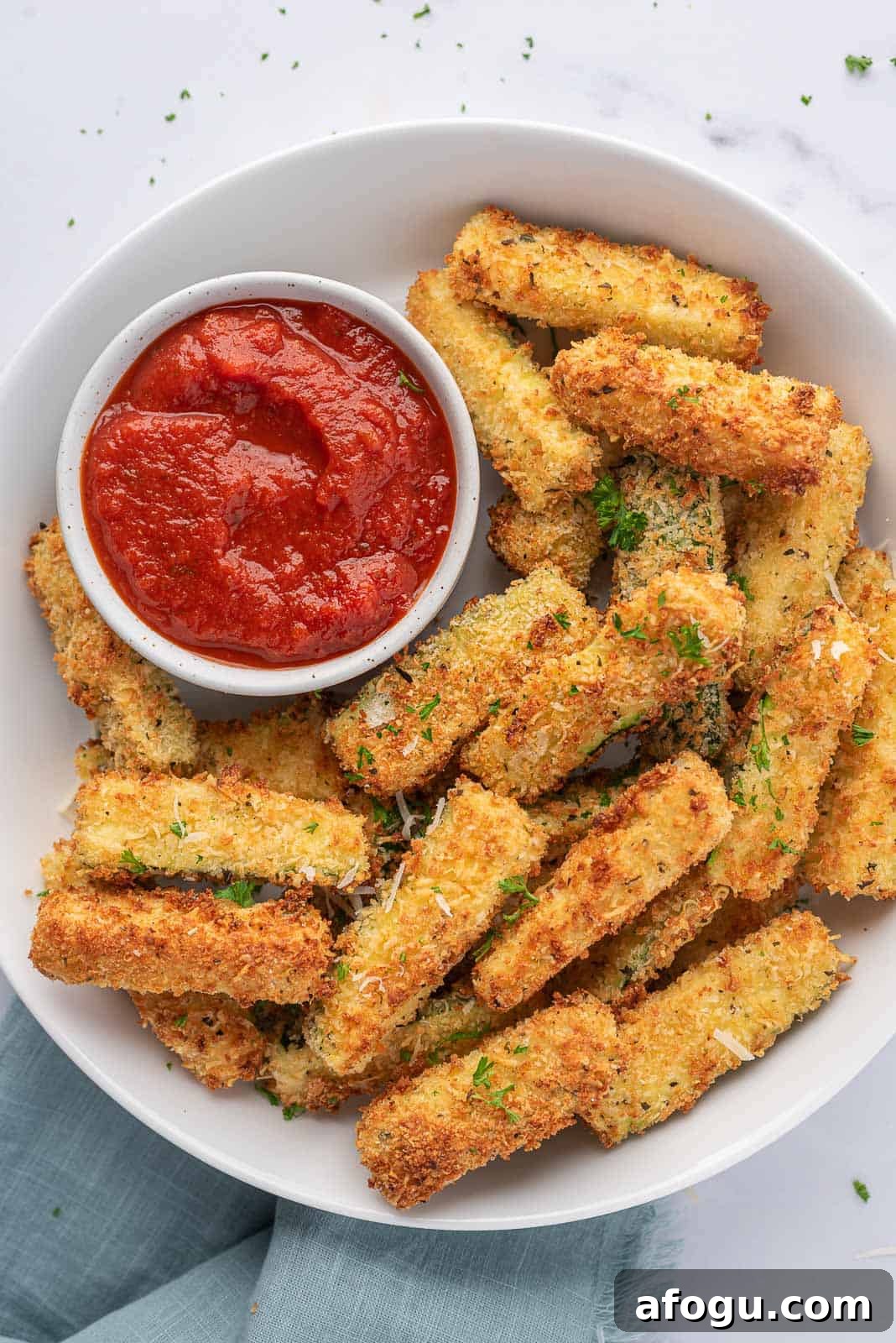 A platter of crispy zucchini sticks.