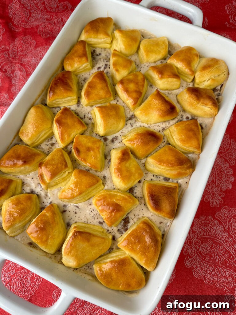 Melted butter brushed on top of biscuits to add more rich flavor and an attractive shine to this biscuits and gravy casserole.
