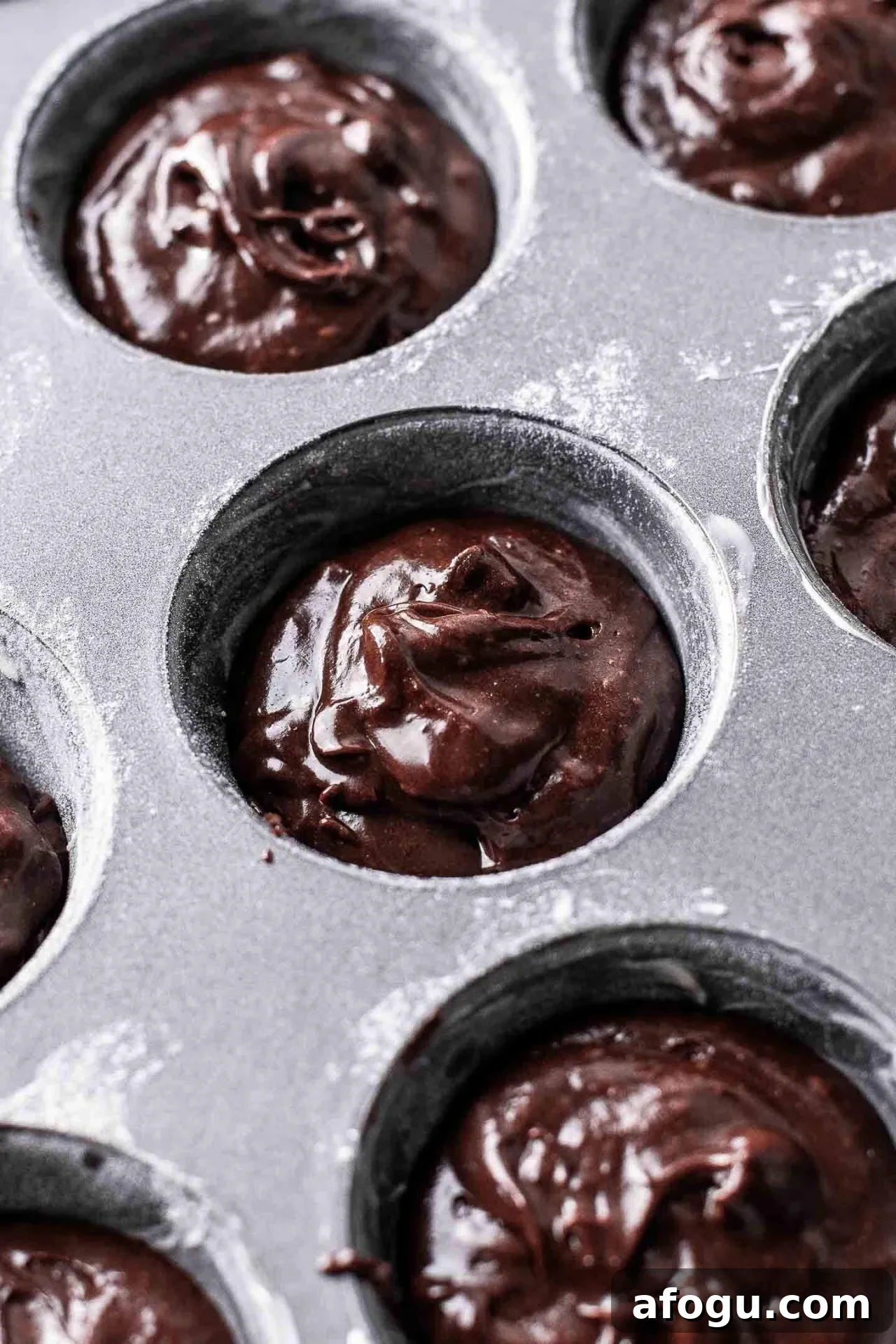 brownie cupcakes batter portioned into cupcake tin