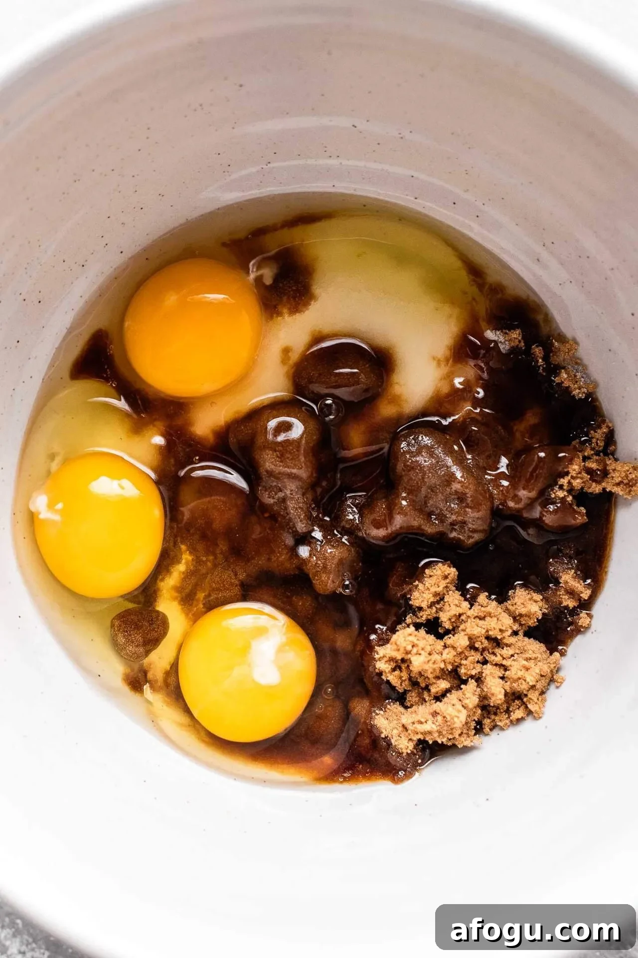 brownie cupcakes eggs and sugar combined in bowl
