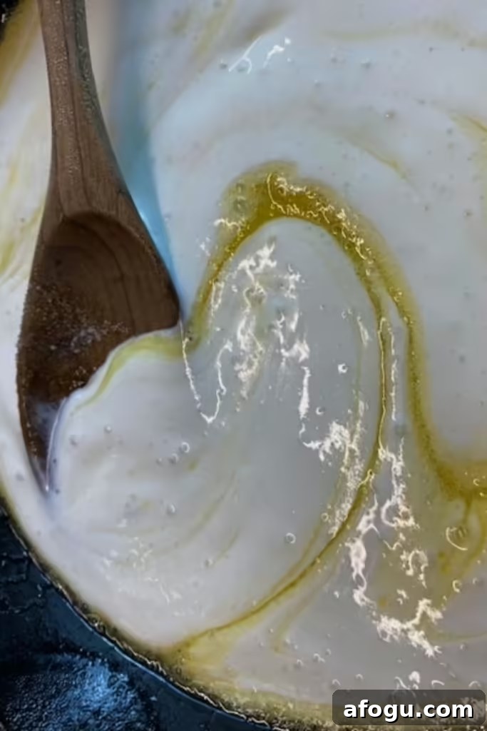 mixing batter in skillet