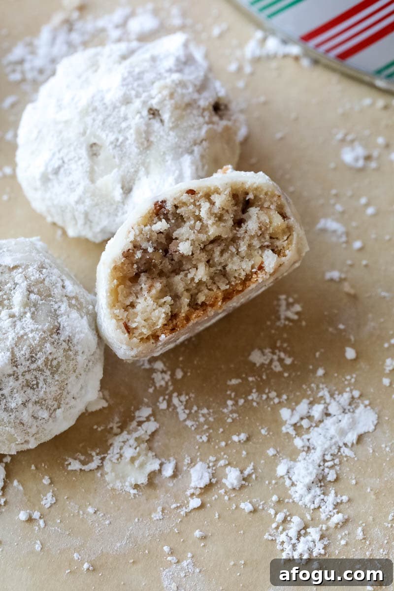 close up of snowball cookies with center showing 