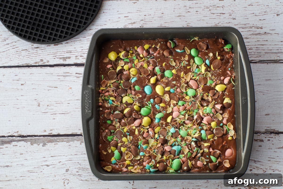 Crushed mini eggs sprinkled on top of fudge and pressed into fudge.