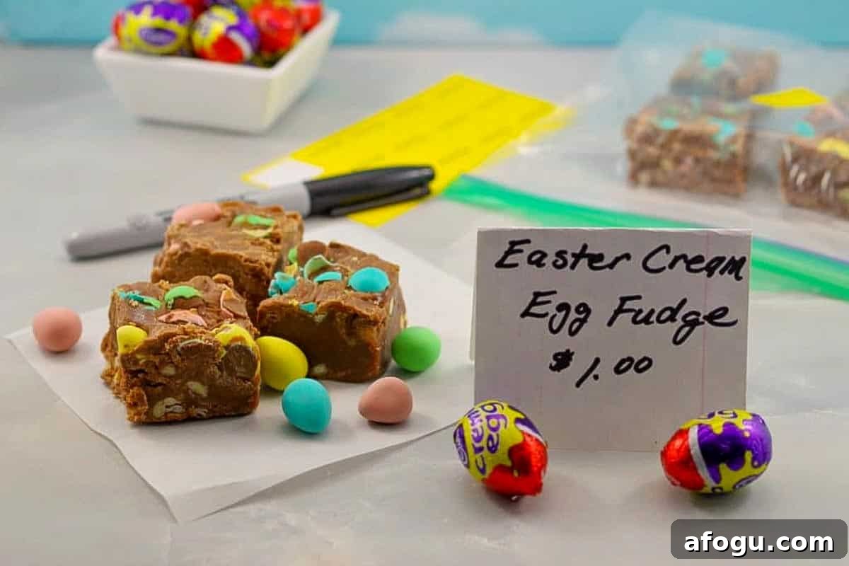 3 squares of Easter Egg Fudge on a piece of parchment paper with a bake sale price sign in front.