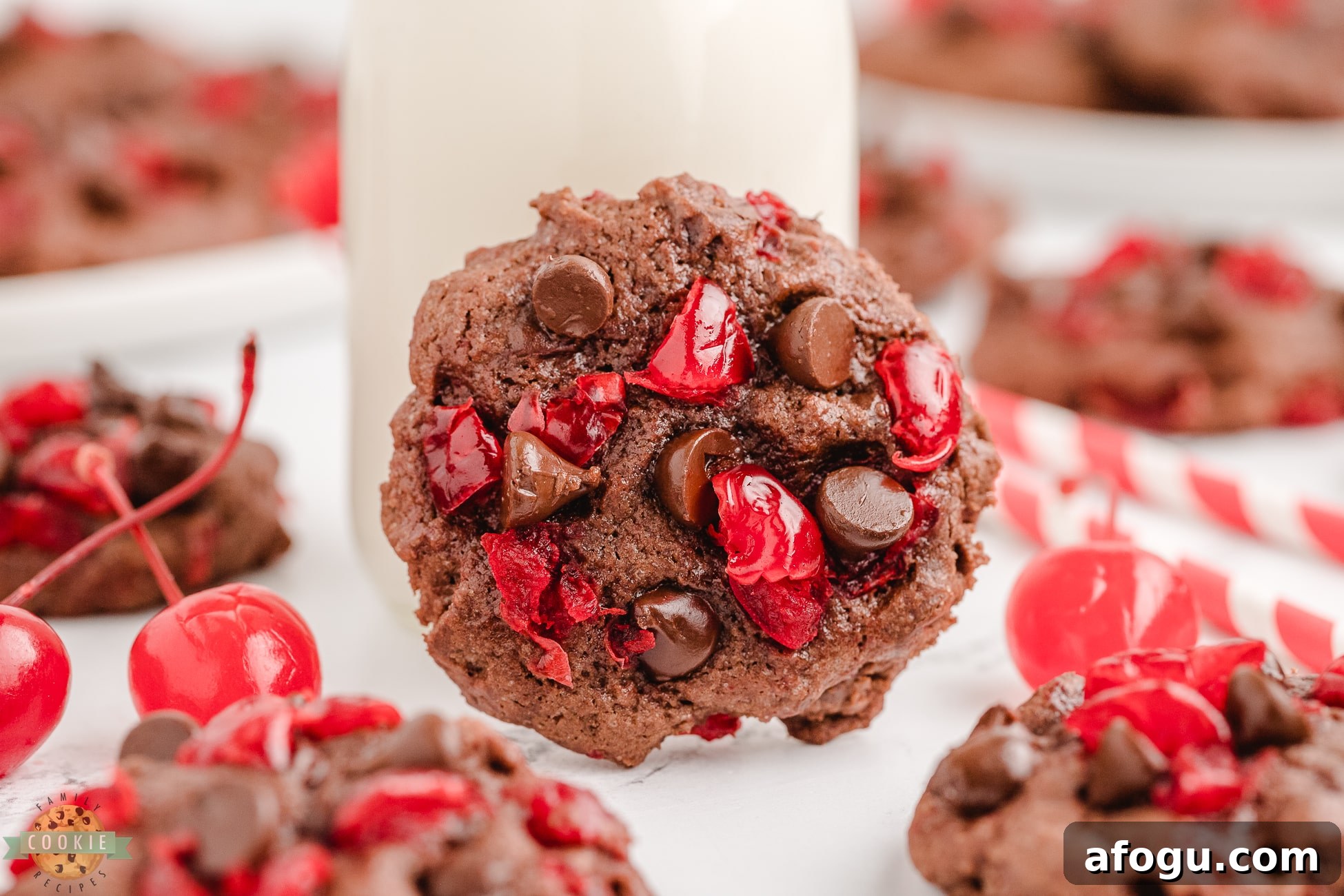 cherry chocolate cookie with a glass of milk