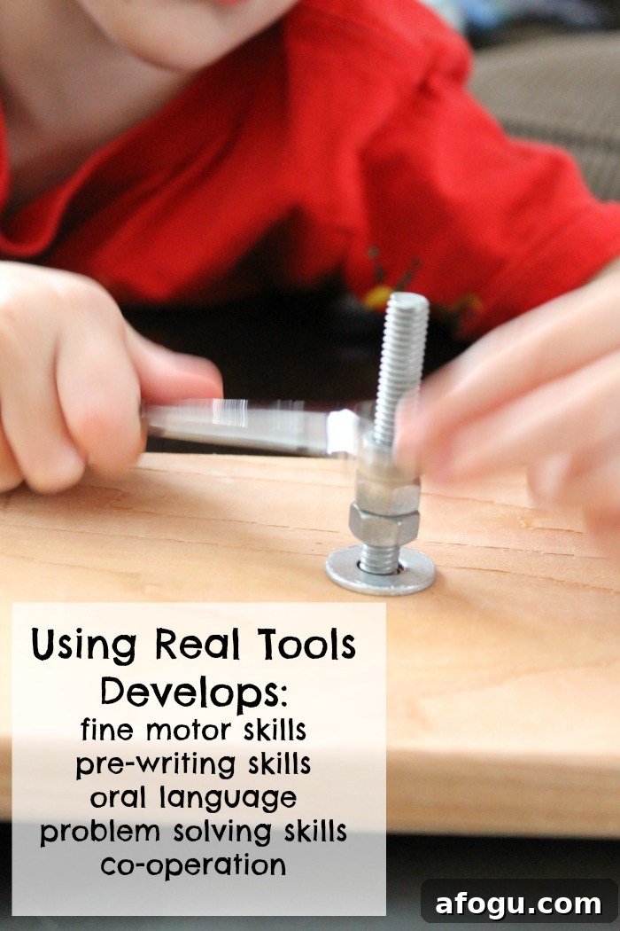 child using a wrench on nuts and bolts on a piece of wood