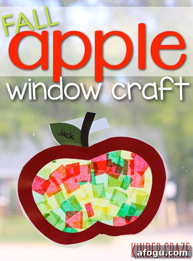 apple craft with tissue paper hanging on a window