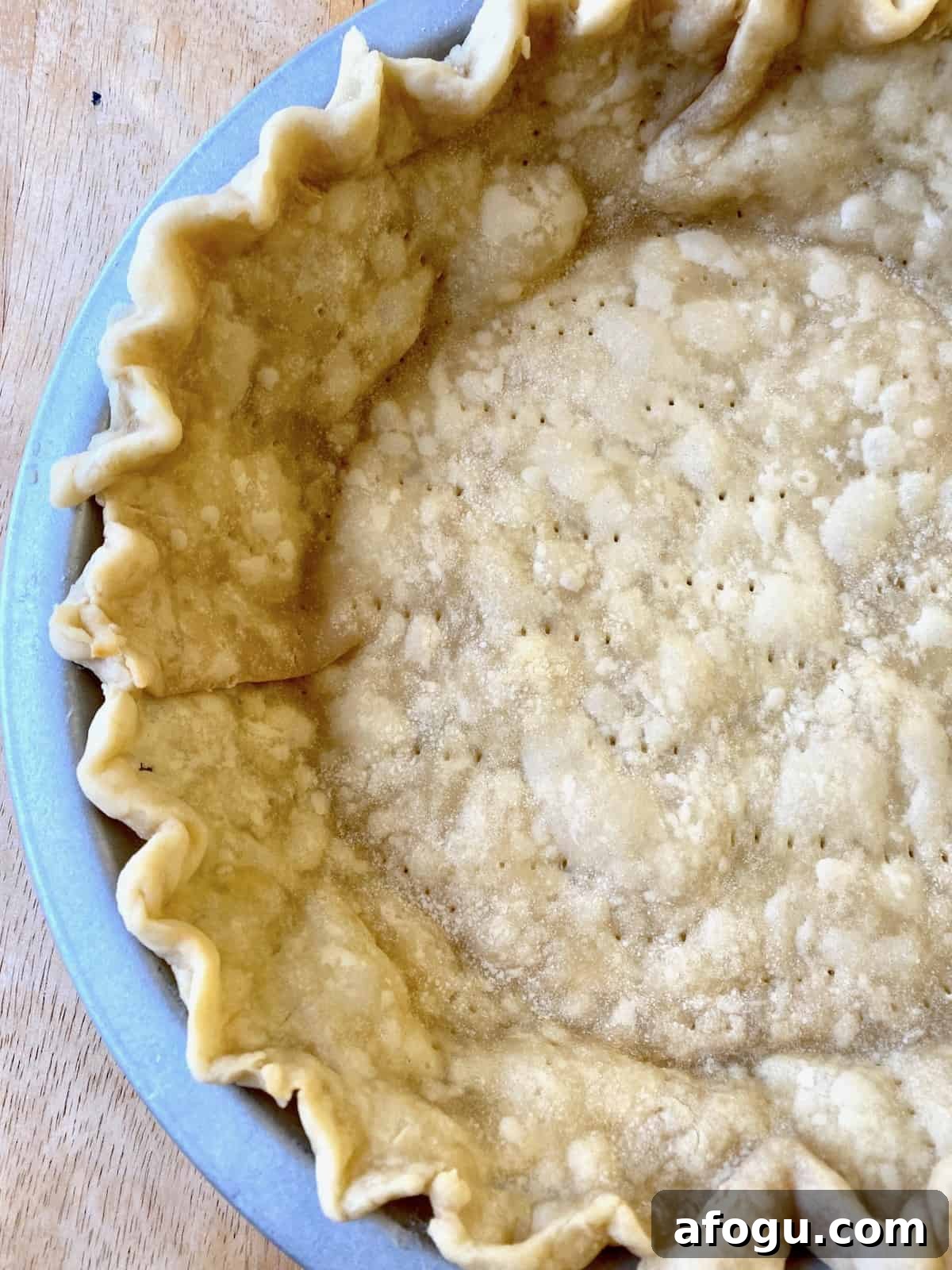 Baked pie crust in a pie dish.